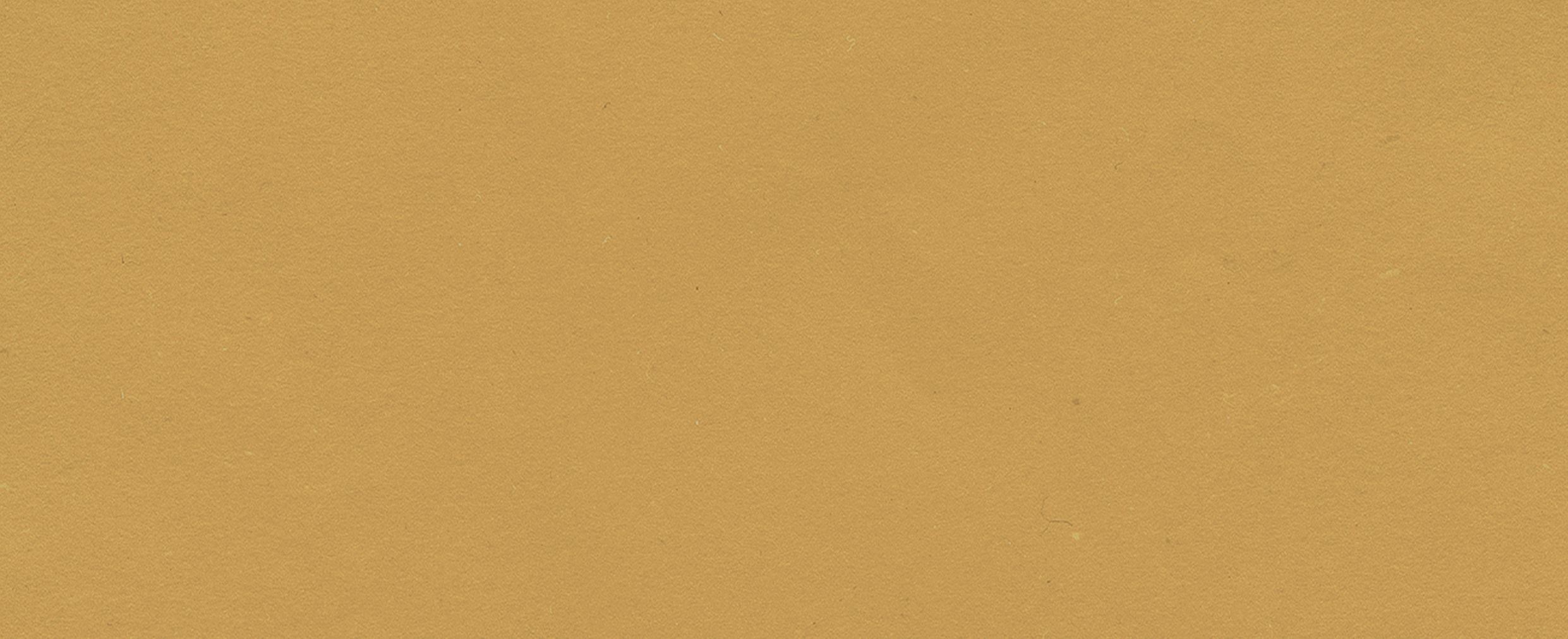 Solid textured background in a golden yellow color, inspired by the inviting ambiance of The Grazery restaurant at Two Step Farm, TX—a perfect shade for new homes in Montgomery County.
